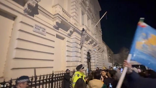 Footage shows the police violently clashed with protesters outside the Iranian embassy in London after an activist climbed the building and took down the Islamic Republic's flag