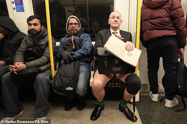 A man takes part in the annual No Trousers Tube Ride on the London Underground on Sunday