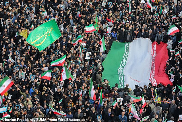 Pro-government demonstrators rally at Enghelab (Revolution) Square in central Tehran in support of the Islamic Republic
