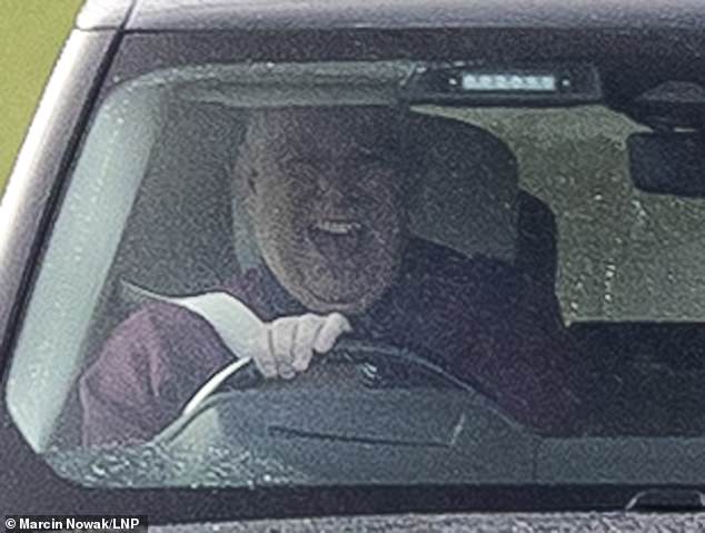 The former prince was pictured cracking up this morning as he sat behind the wheel en route to the stables