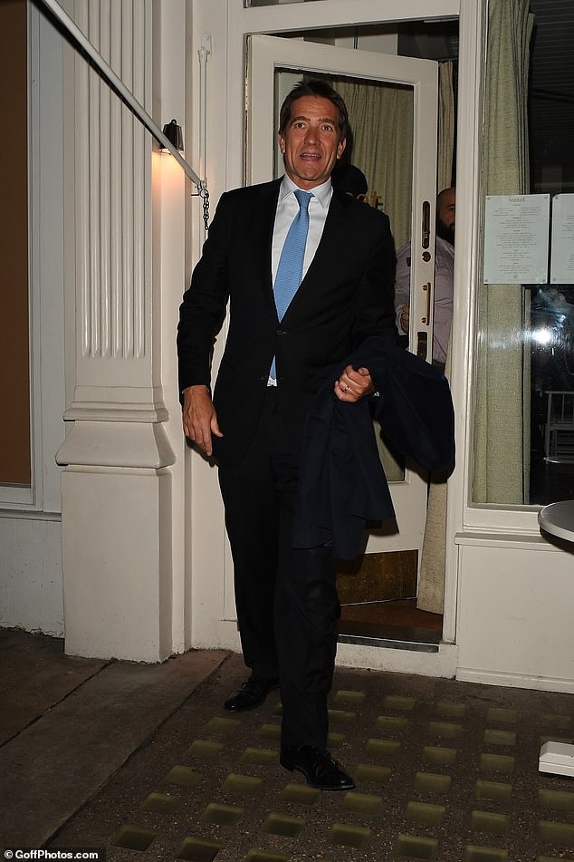 Meanwhile, her film producer husband looked incredibly dapper in a black suit, paired with a crisp white shirt and a smart blue tie