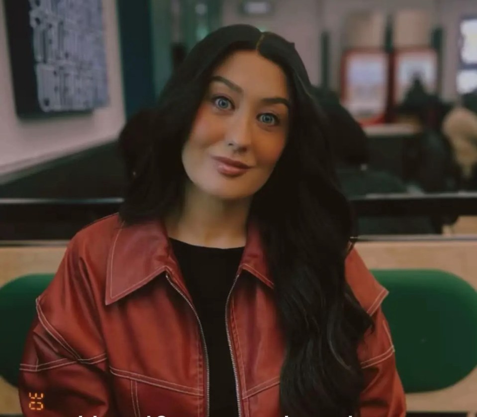 Woman in a red jacket smiling, with text overlay: "I lost 16 stone and stuck to my new routine."