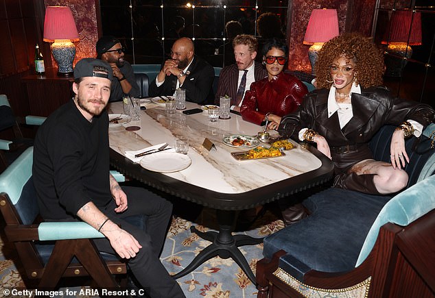 The aspiring chef enjoyed a night out without his wife Nicola Peltz as he mingled with Hollywood stars (Brooklyn, Steelo Brim, Ryan Shaffer, Teyana Taylor and Winnie Harlow L-R)