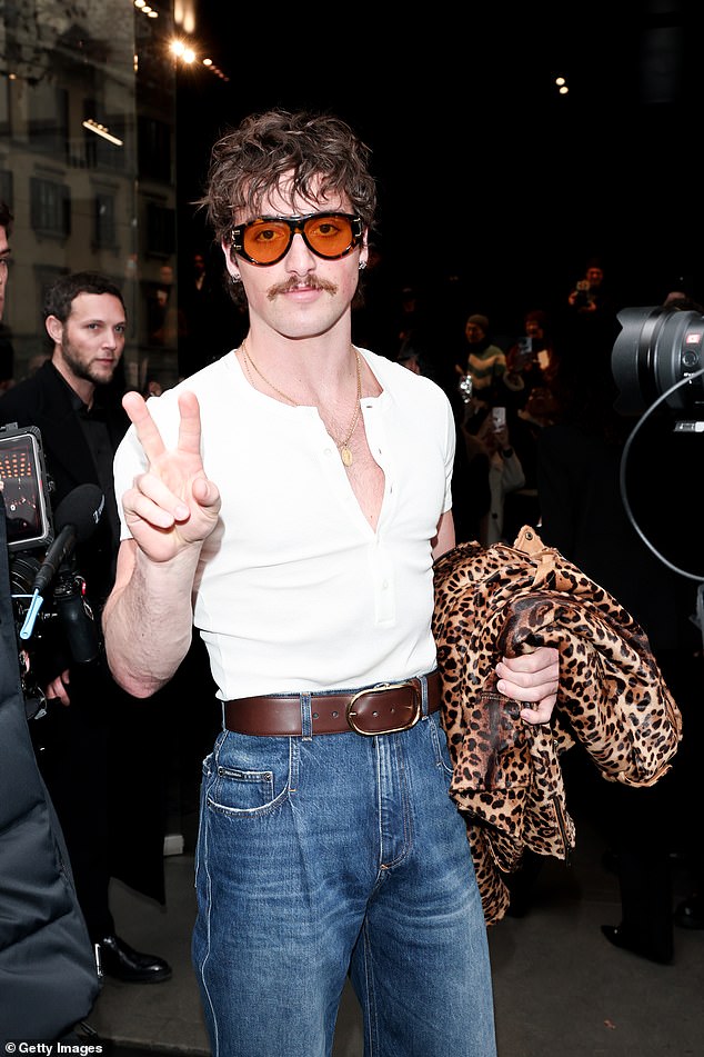 Benson Boone, 23, was also seen at the star-studded catwalk in high-waist denim jeans and a white T-shirt