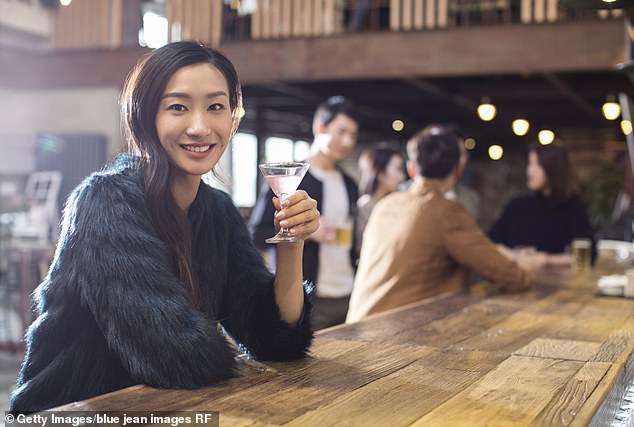 The dating experts said the outfit has to match the setting, so leave the dramatic faux fur coat at home if you're heading to a dive bar (stock photo)