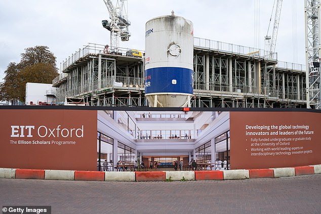 Hoardings showing imagery of the future development surrounds the construction site of the 'EIT Oxford' research institute