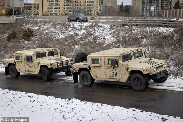 Army troops are reportedly standing at the ready as president Trump cracks down on protests in Minneapolis. Pictured: Minnesota Army National Guard soldiers in Minneapolis on January 17, 2026