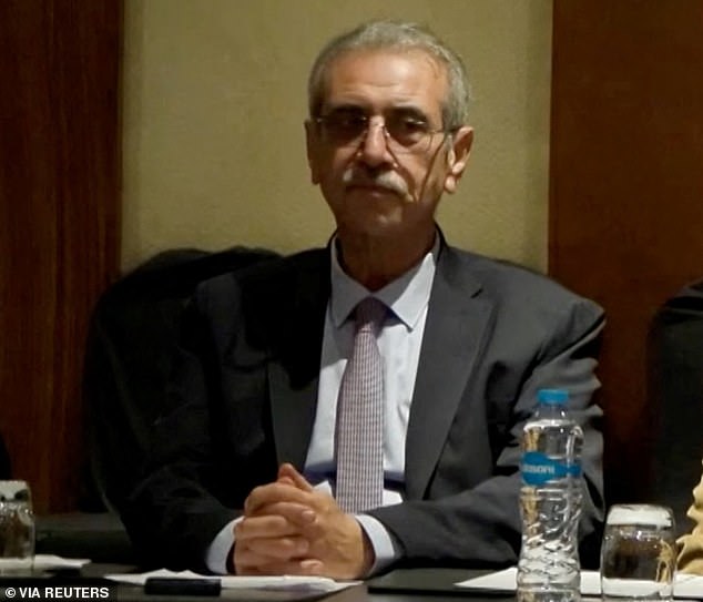 Ali Shaath is serving as the general commissioner of the Palestinian-run National Committee for Administration of Gaza, which will work with the BOP and Trump to rebuild the region. He's pictured above at a meeting on Friday