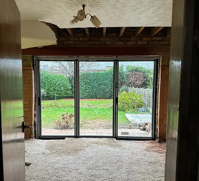 So far they have removed four structural walls, got rid of an entire chimney and added in bifolding doors (pictured)