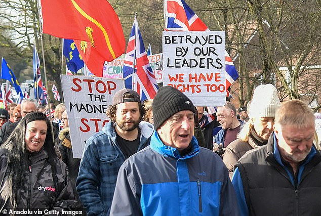 One sign read 'Betrayed by our leaders. We have rights too', while another read: Stop the madness