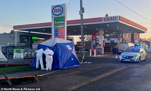 Forensics teams were seen at the petrol station on Friday as seven people were arrested