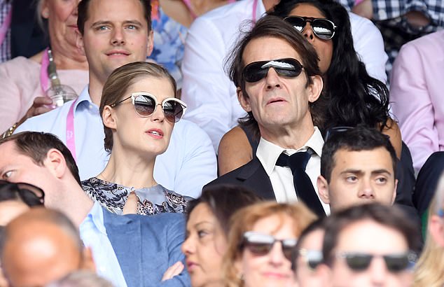 Rosamund pictured with partner and father of her sons Robie Uniacke in 2017