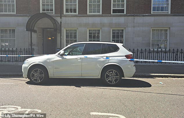 Blue's BMW X3 was parked just 100 metres away and was cordoned off behind police tape