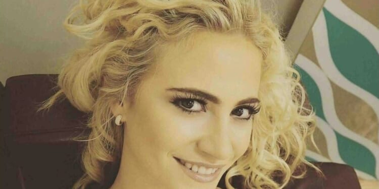 Pixie Lott ditches famous blonde locks for brand new look as she enjoys night out in London
