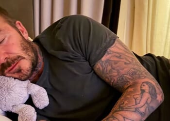 David Beckham uses cuddly toy as pillow after dancing himself into a slumber with wife Victoria and daughter Harper