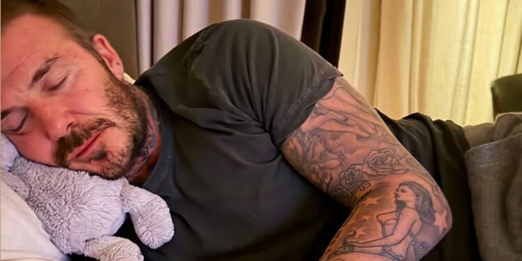 David Beckham uses cuddly toy as pillow after dancing himself into a slumber with wife Victoria and daughter Harper