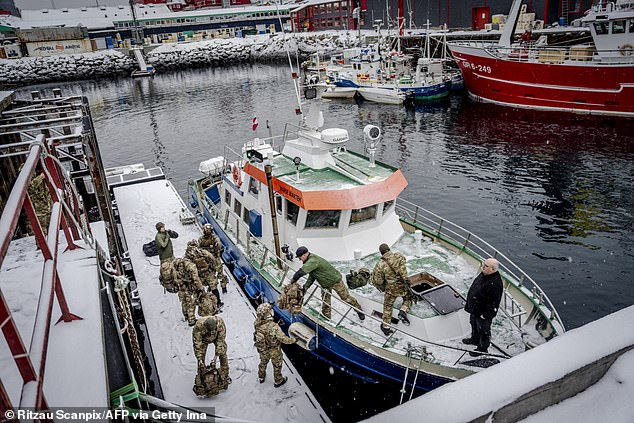 Danish soldiers in uniform disembark at the harbor in Nuuk, Greenland on January 18, 2026