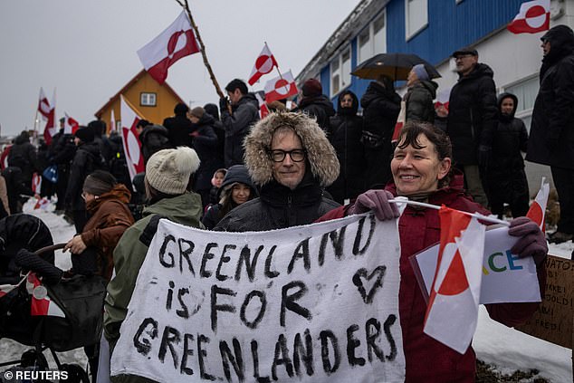 People attend a protest on January 17, 2026 in front of the US consulate in Nuuk, Greenland against President Trump's demand that the Arctic island be ceded to the United States