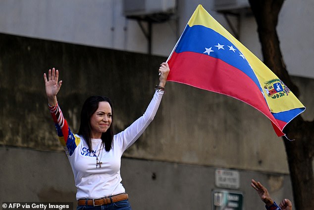 Venezuelan opposition leader Maria Corina Machado waves the flag in January 2025
