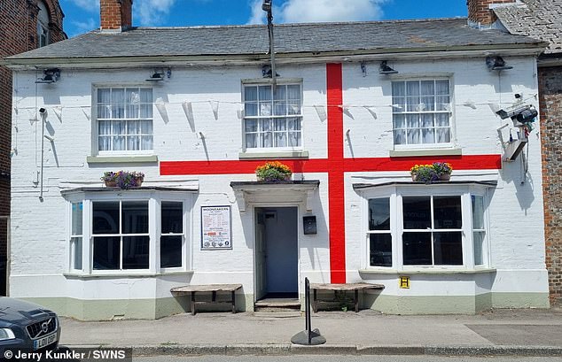 Mr Kunkler, Wiltshire's longest-standing councillor, repainted the exterior in 2022 ahead of the World Cup