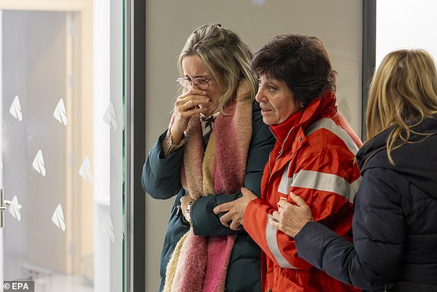 Relatives of victims arrive seeking information about the derailment at Huelva train station in Huelva, Spain, 19 January 2026