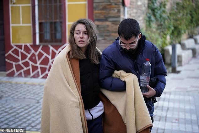 Ana, one of the victims of a deadly derailment of two high-speed trains, looks on at the Citizen Help Center while seeking her missing dog, which travelled with her and her sister, now hospitalised, during the accident near Adamuza, in Cordoba, Spain, January 19, 2026