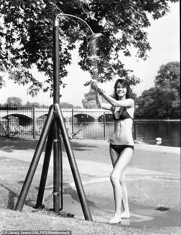 Despite more Britons looking slimmer in the 1970s, most people were not consciously dieting. Pictured, a woman cooling off in a swimsuit during the heatwave of summer 1976