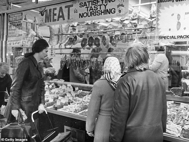 People consumed fewer calories, but tended to have a diet high in saturated fats. Pictured, shoppers examining the produce at a butchers in Chapel Street Market, Islington, London, 1973