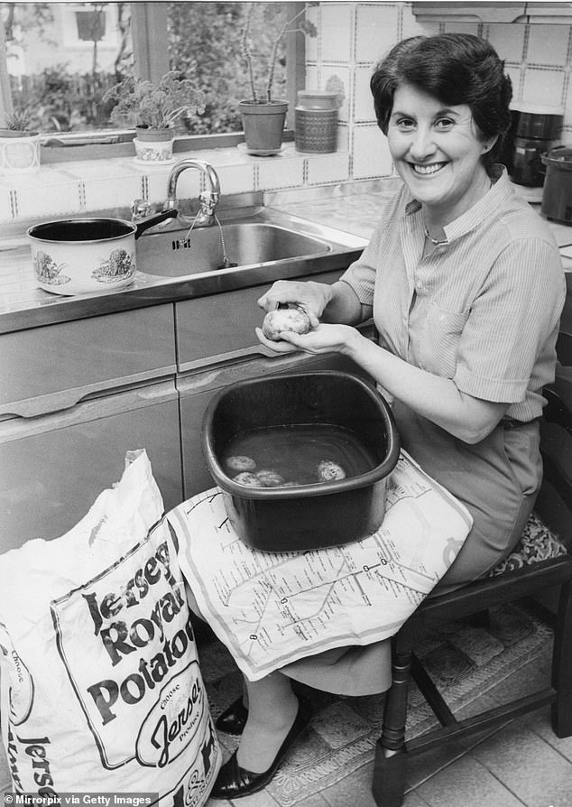 'People born in the '30s, '40s and '50s had lived through rationing and saw wasting food as quite immoral, so they wouldn't dream of making or serving more than was needed', says food historian Pen Vogler. Pictured, a housewife peeling potatoes circa 1970