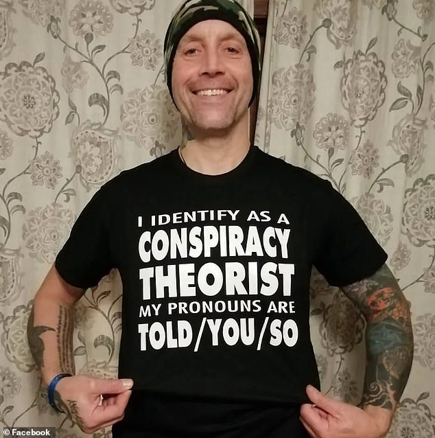 Hope's founder Matthew Single wearing a T-shirt  branded with the words 'I identify as a conspiracy theorist'