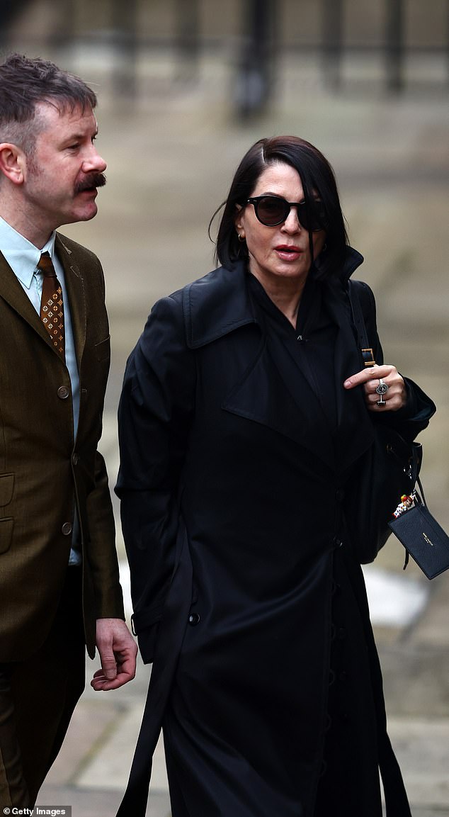 Sadie Frost arriving at the High Court with her solicitor today