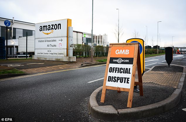 A GMB sign outside the Amazon warehouse in Coventry during a walkout in March 2024