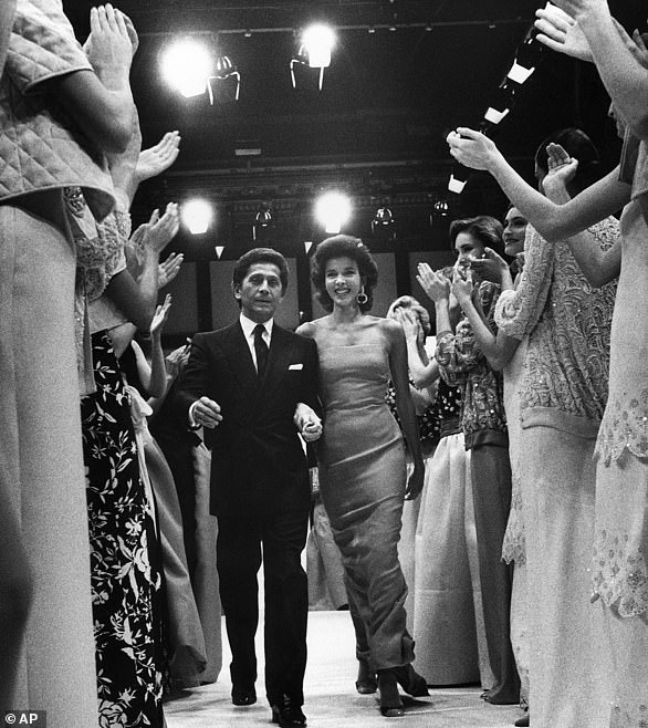 Seen with models after he presented his Spring-Summer High fashion collection in a Rome hotel in 1985