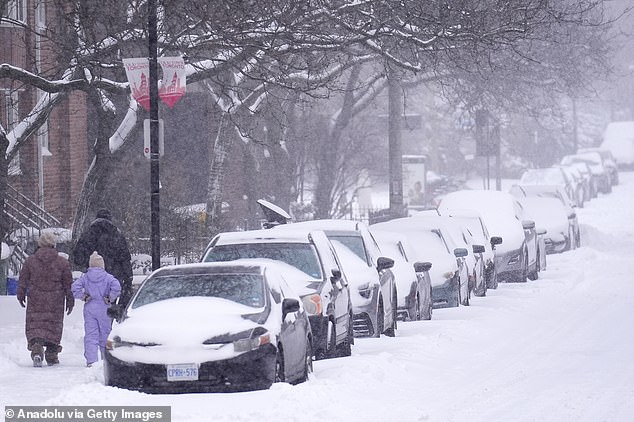 Arctic air from Canada, winter conditions seen above in Toronto, is set to sweep down over the weekend, with the southern storm whipping up toward the Mid-Atlantic states