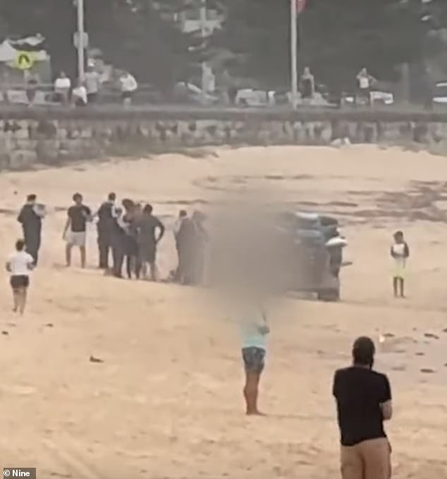 First responders treated the man on the sand before he was rushed to hospital