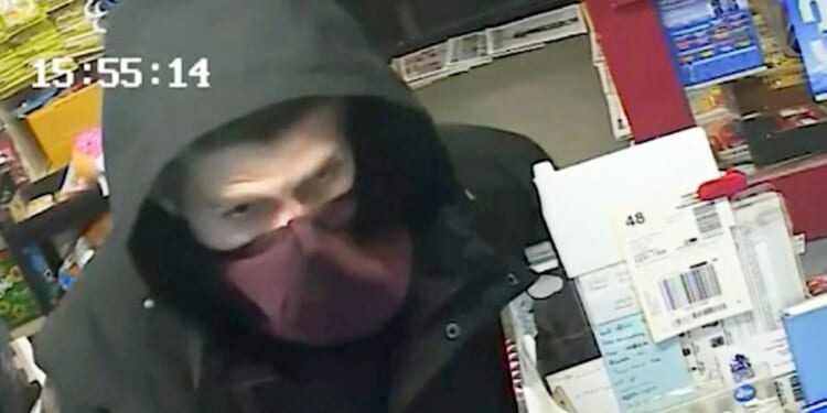 Moment brave shopkeeper armed with only walking stick fights off knife-wielding robber