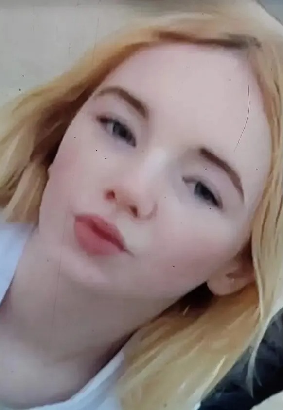 Close-up of Tahlia Jardine, a young woman with blonde hair, looking up at the camera.