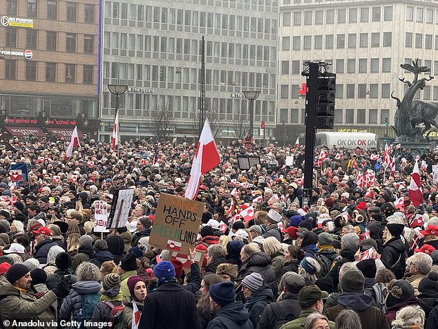 People take part in the 'Hands Off Greenland' protest in front of the US Embassy in Copenhagen, Denmark, chanting slogans such as Hands Off Greenland'