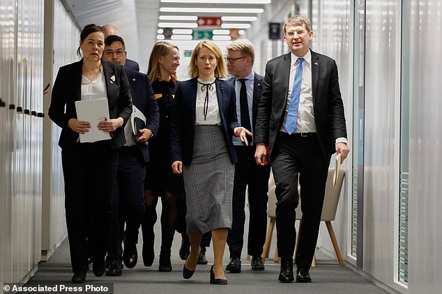 European Union foreign policy chief Kaja Kallas, center, walks with Minister for Foreign Affairs and Research of Greenland Vivian Motzfeldt, left, and Denmark's Defense Minister Troels Lund Poulsen, right, prior to a meeting at EU headquarters in Brussels on Monday
