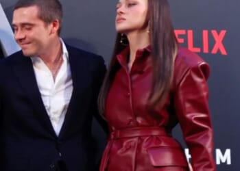 Watch the tense moment Brooklyn pulls fuming wife Nicola into Beckham family pic at premiere