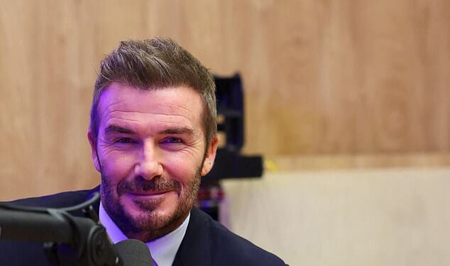David Beckham struggled to smile as he was pictured for the first time since son Brooklyn's explosive statement about their family feud on Tuesday as he appeared at the World Economic Forum in Davos