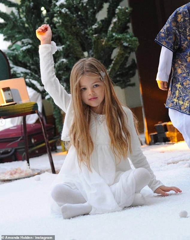 Amanda also shared a sweet throwback photo of Lexi as a child as she posed in a similar way while sat by a Christmas tree