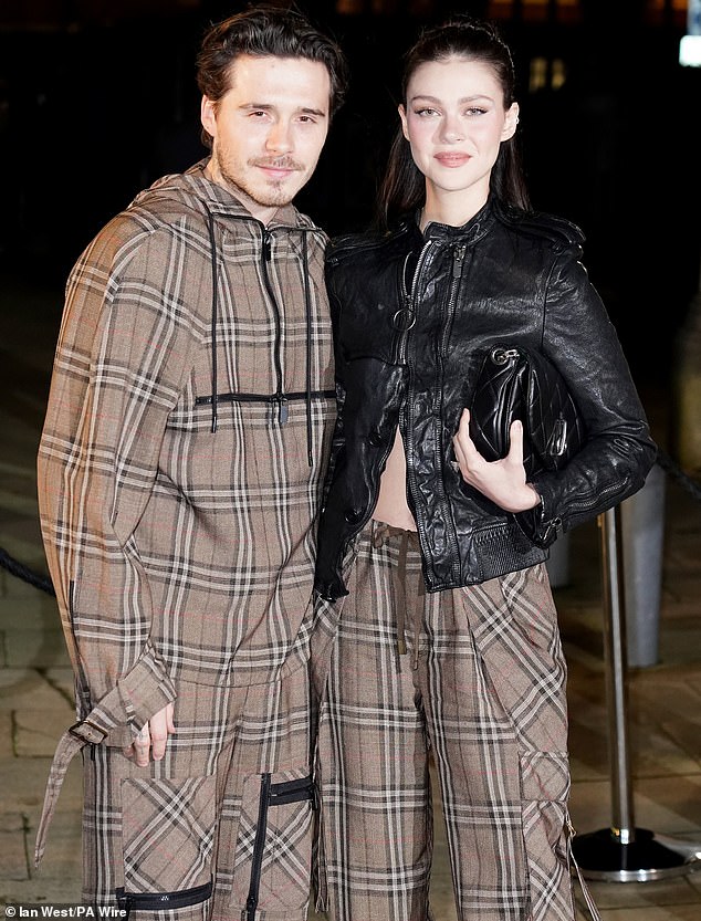 Around this time, Brooklyn had told his parents to only contact him through lawyers but ramped things up on Monday when he launched an extraordinary attack on David and Victoria, accusing them of 'controlling' him in a lengthy statement (pictured with wife Nicola)