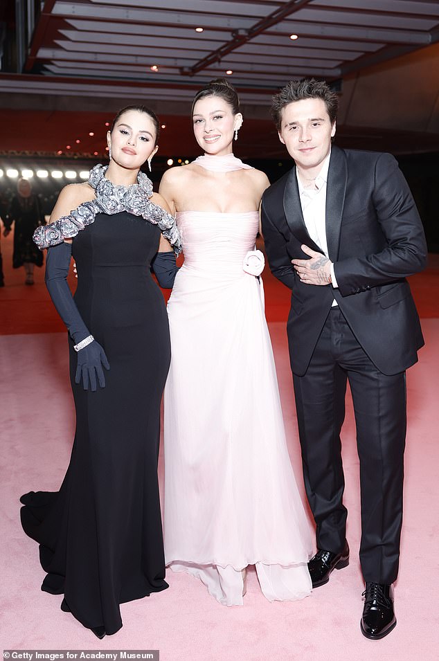 Selena, Nicola and Brooklyn famously formed an incredibly close bond with the singer cementing their closeness when she joked they were in 'throuple' back in 2023 (pictured)