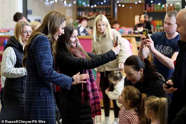 The Duchess of Rothesay when in Scotland, poses for a selfie with a member of the public, during a visit to the National Curling Academy in Stirling