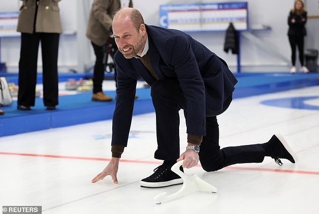 The Prince of Wales has a go at curling at the National Curling Academy in Stirling today