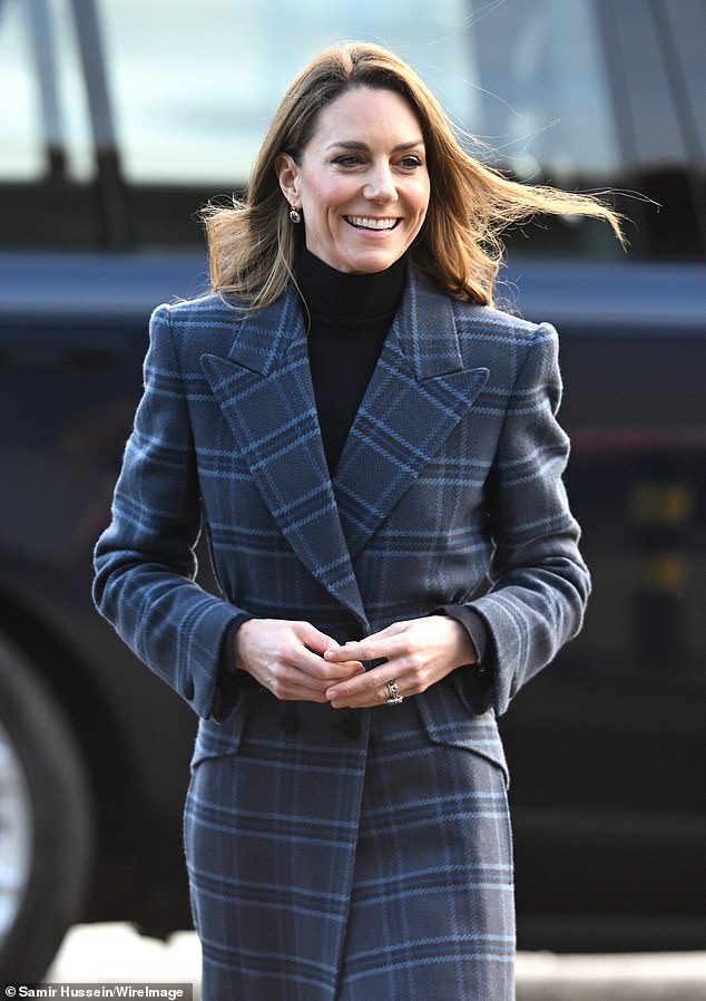 The Princess of Wales smiles as she arrives for a visit to the National Curling Academy today