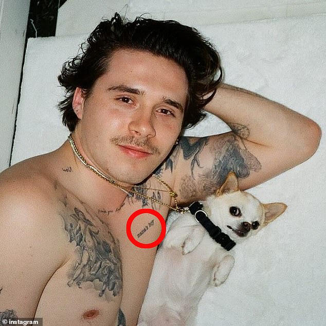 Brooklyn unveiled the 'mama's boy' inkwork (seen on his chest) in 2019 after first visiting a tattoo studio in 2017
