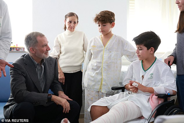King Felipe spoke to youngsters recovering from injuries after the 'very tragic' collision