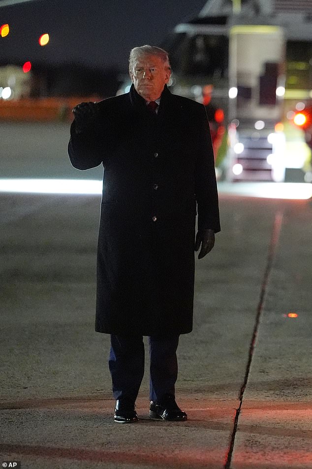 President Donald Trump gestures before boarding Air Force One for a trip to attend the World Economic Form in Davos